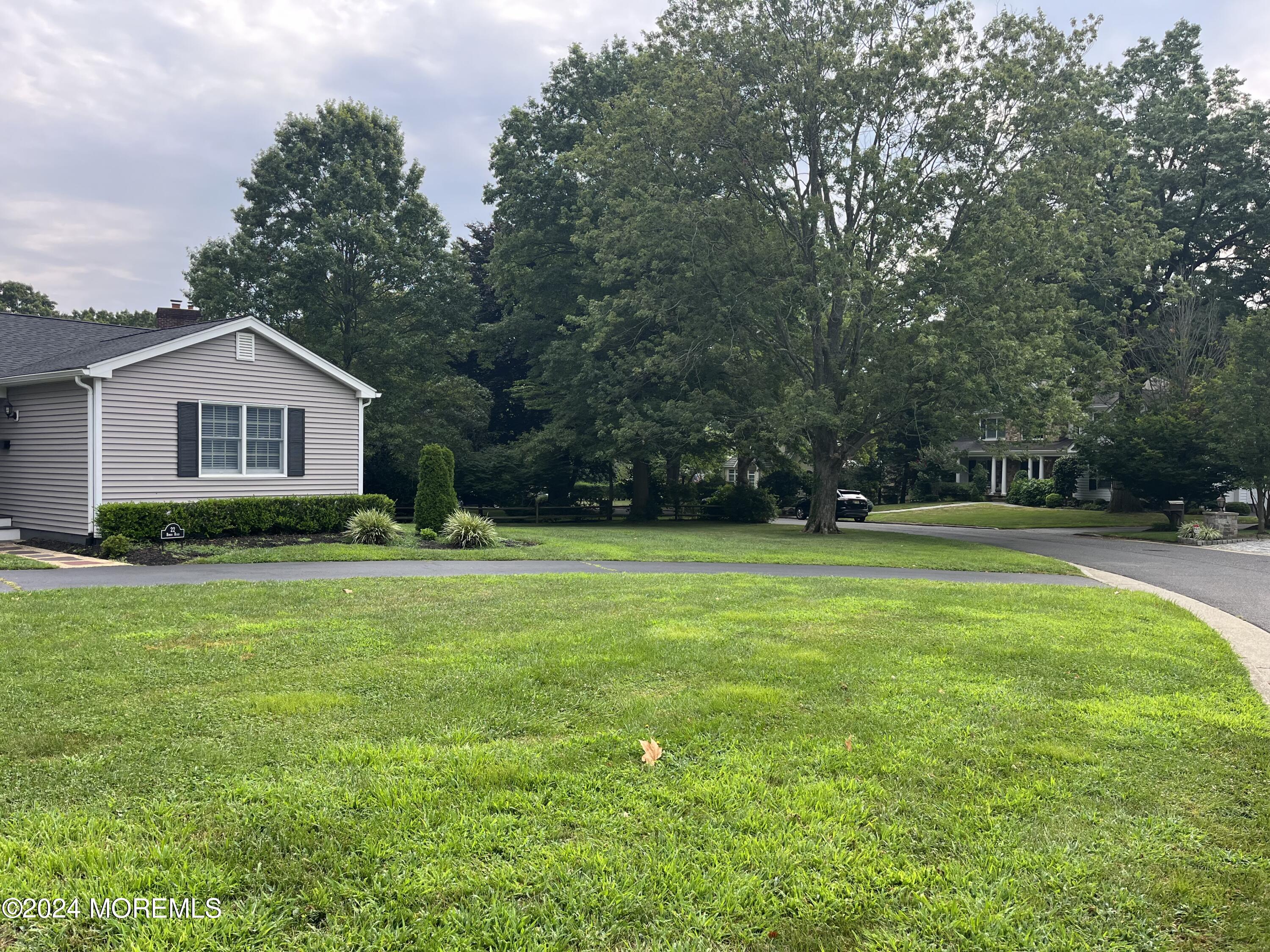 22 Robin Road Rumson, NJ 07760 - Photo 2 of 24 a front view of a house with yard and green space