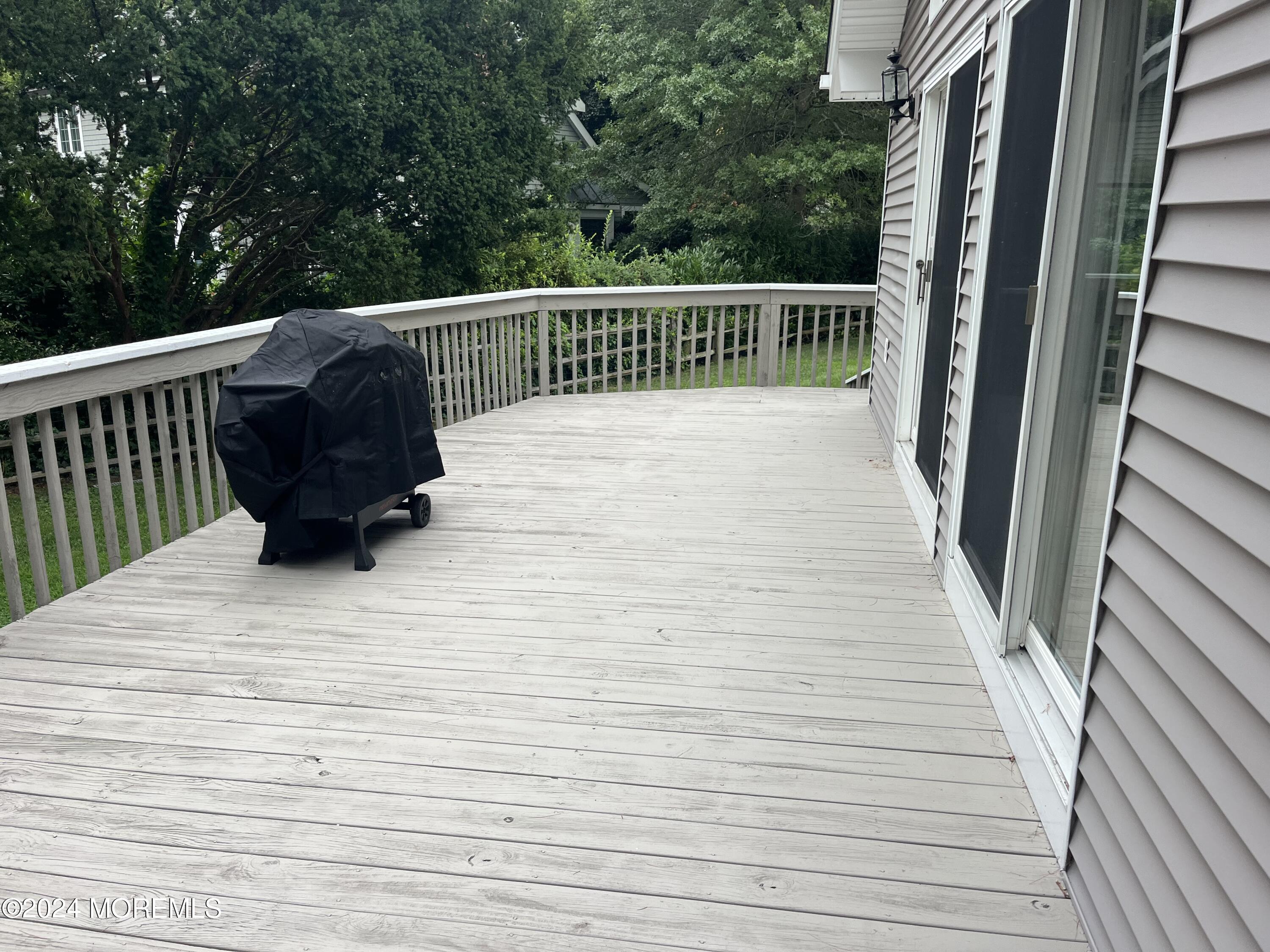 22 Robin Road Rumson, NJ 07760 - Photo 4 of 24 a view of balcony with wooden floor and fence