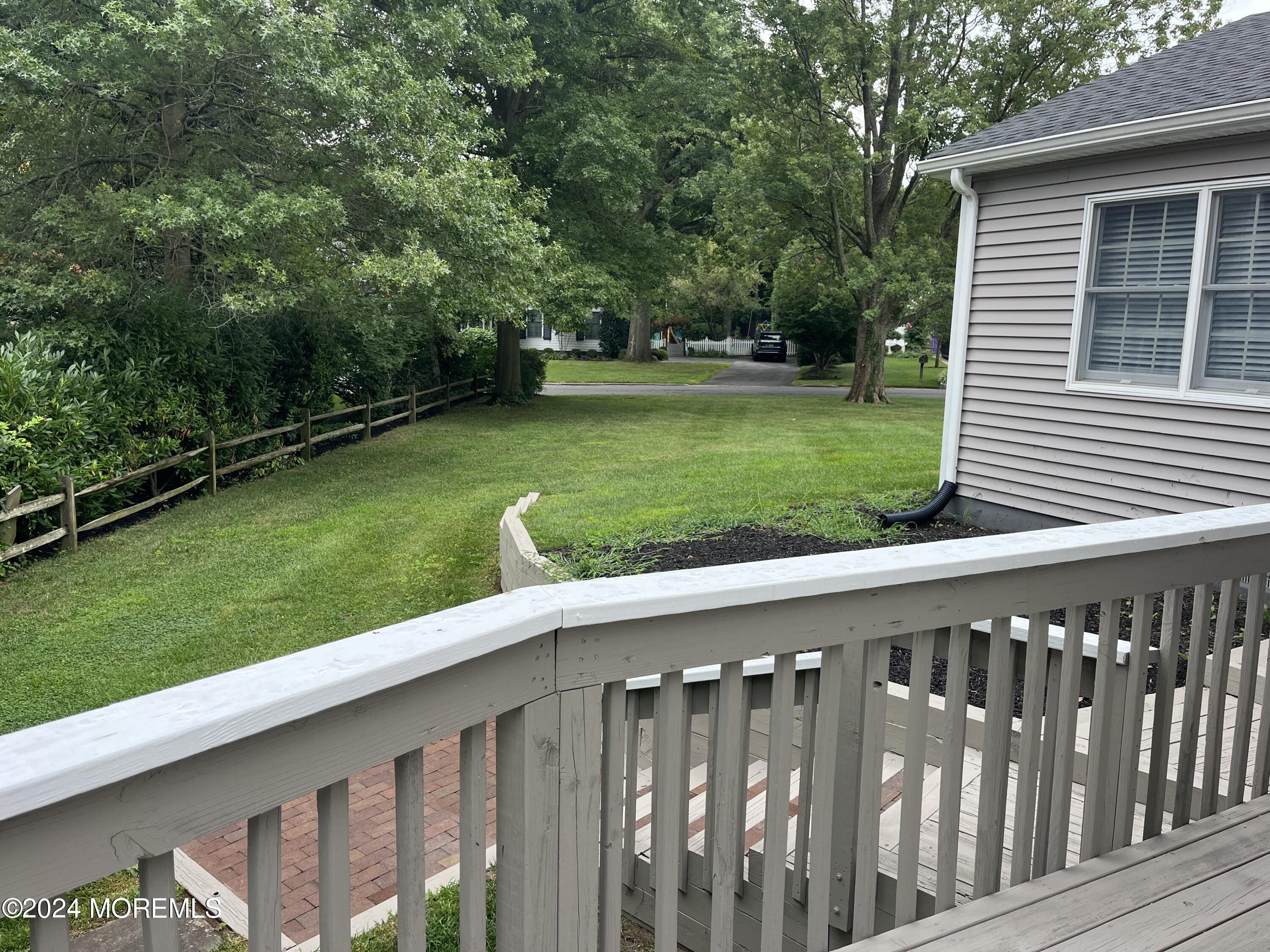 22 Robin Road Rumson, NJ 07760 - Photo 7 of 24 a balcony with a garden