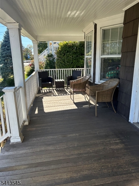 96 Grove Street Montclair, NJ 07042 - Photo 3 of 44 a view of a patio with table and chairs with wooden floor and fence