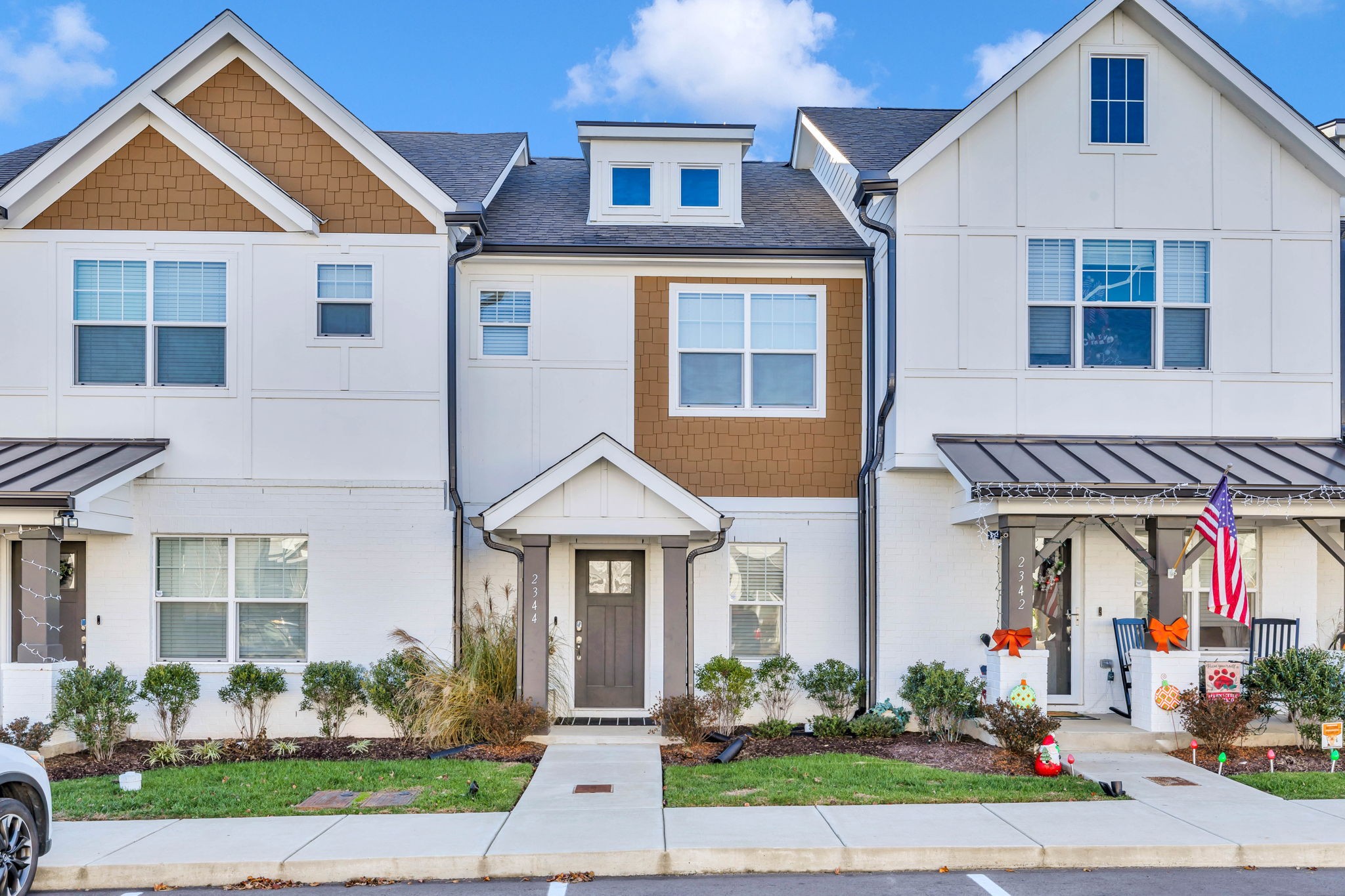 a front view of a house with garden