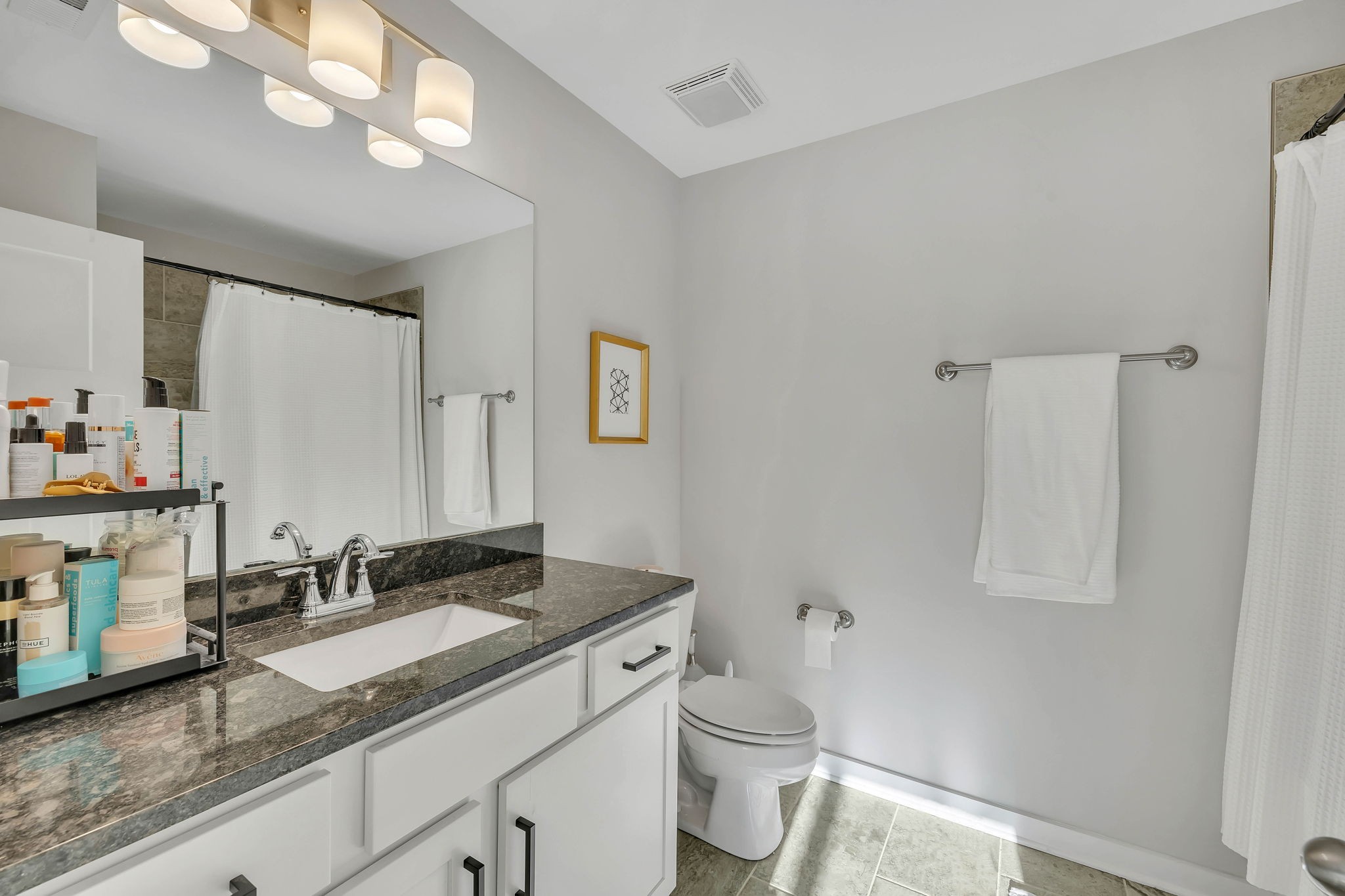 2344 Patrick Avenue Old Hickory, TN 37138 - Photo 15 of 20 a bathroom with a granite countertop sink a toilet and a mirror