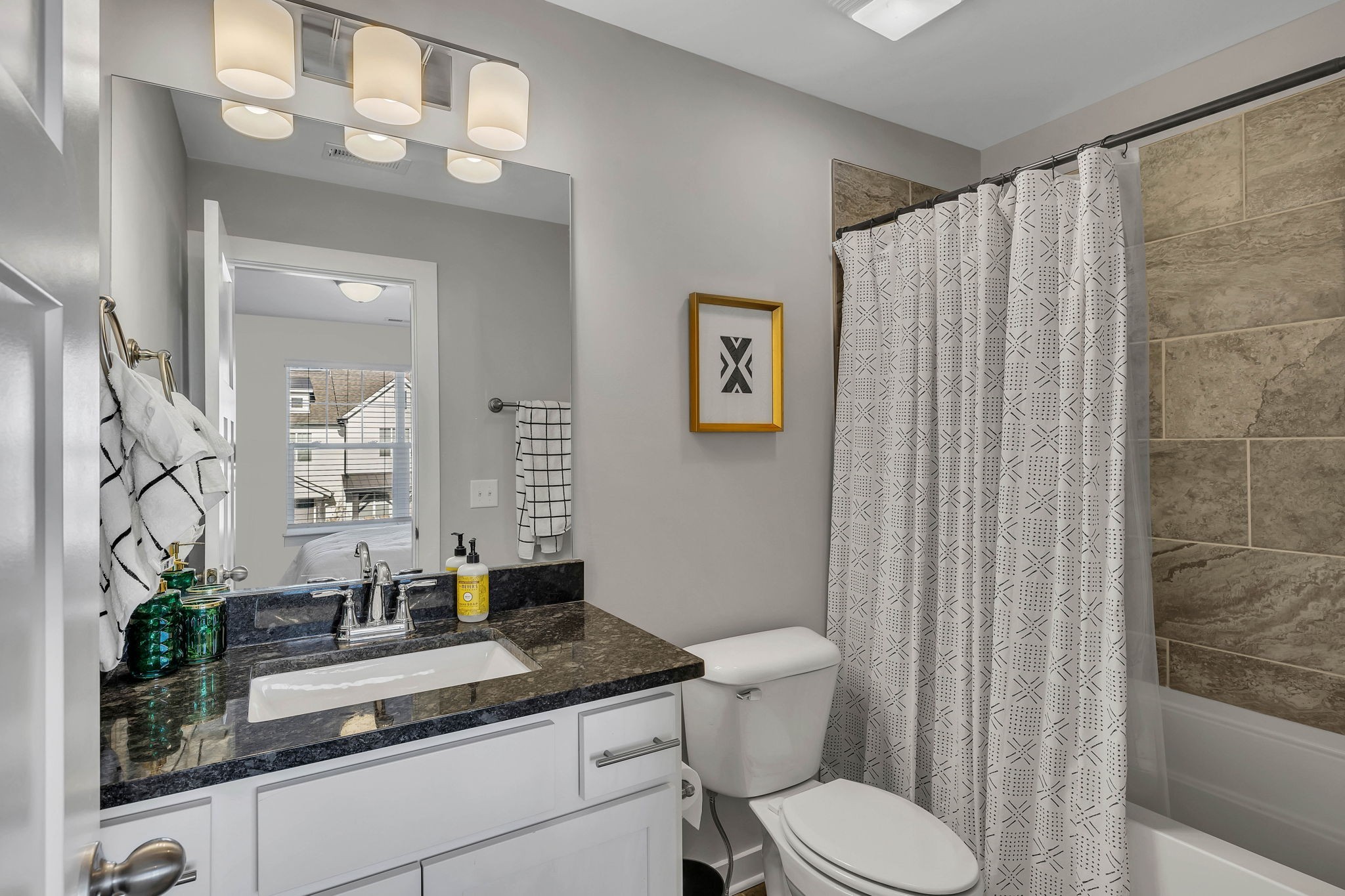 2344 Patrick Avenue Old Hickory, TN 37138 - Photo 18 of 20 a bathroom with a granite countertop sink a mirror and a toilet