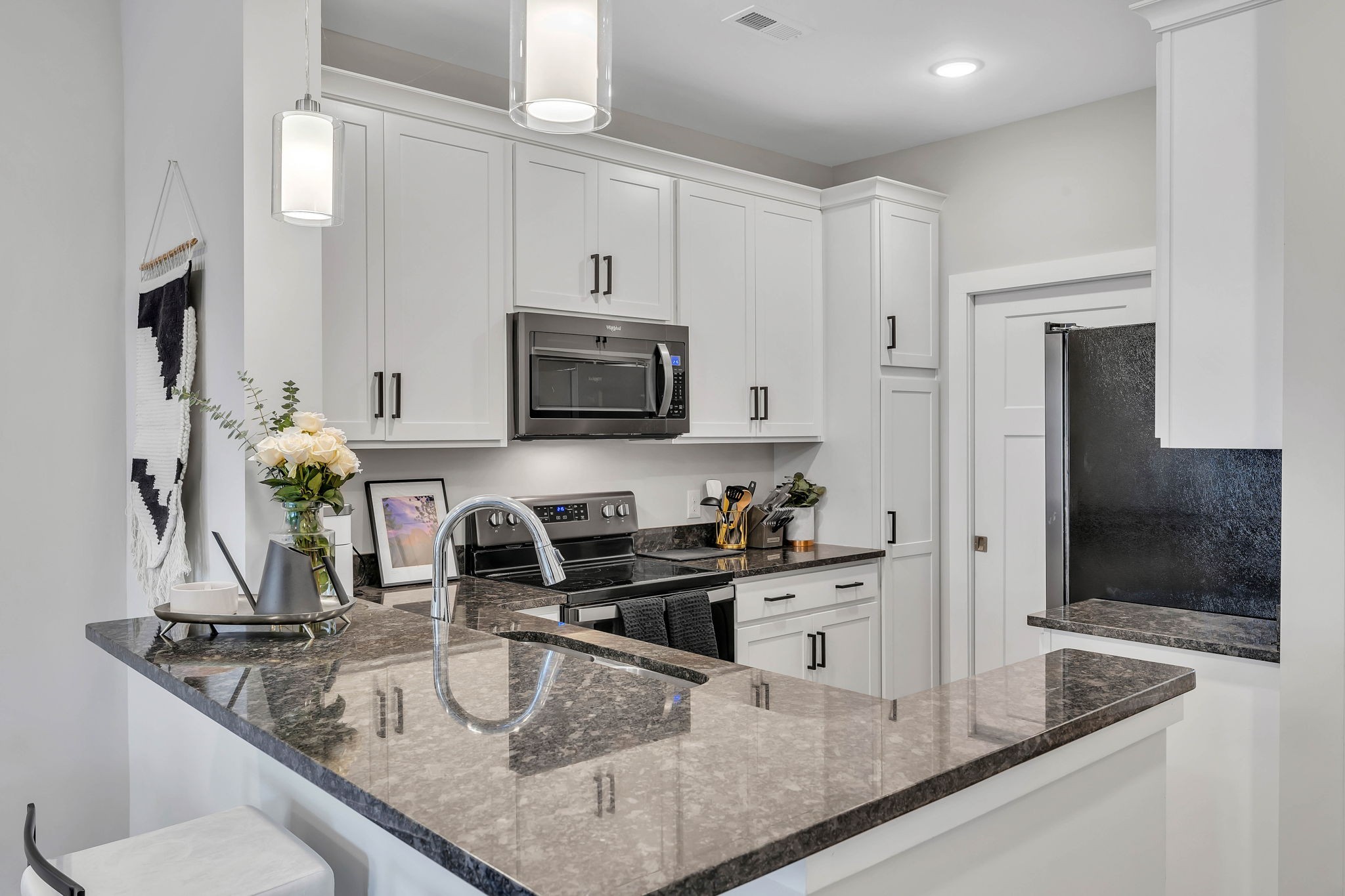 2344 Patrick Avenue Old Hickory, TN 37138 - Photo 6 of 20 a kitchen with kitchen island granite countertop a sink appliances and cabinets