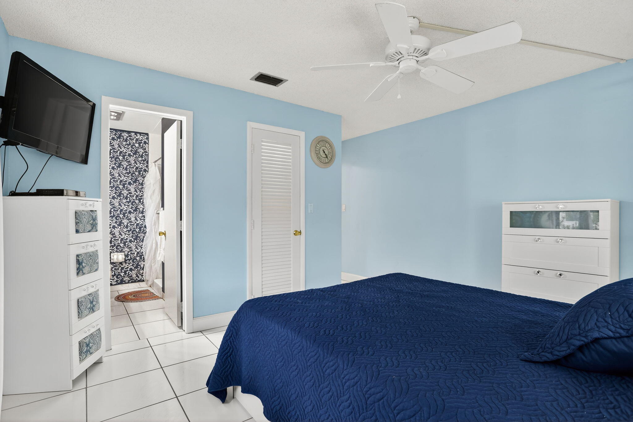 161 Northwest 24th Court Pompano Beach, FL 33064 - Photo 15 of 45 a bedroom with a bed and a flat screen tv