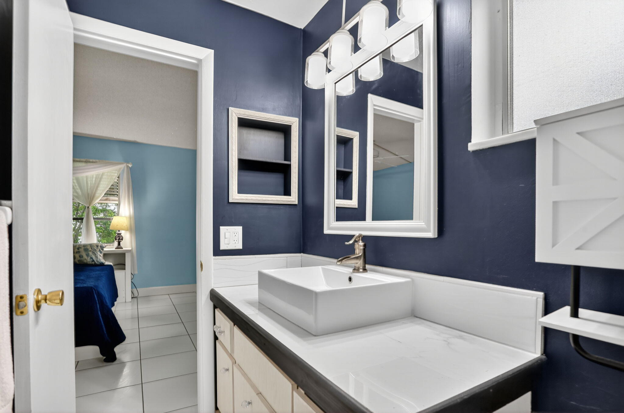 161 Northwest 24th Court Pompano Beach, FL 33064 - Photo 17 of 45 a bathroom with a sink vanity and a mirror