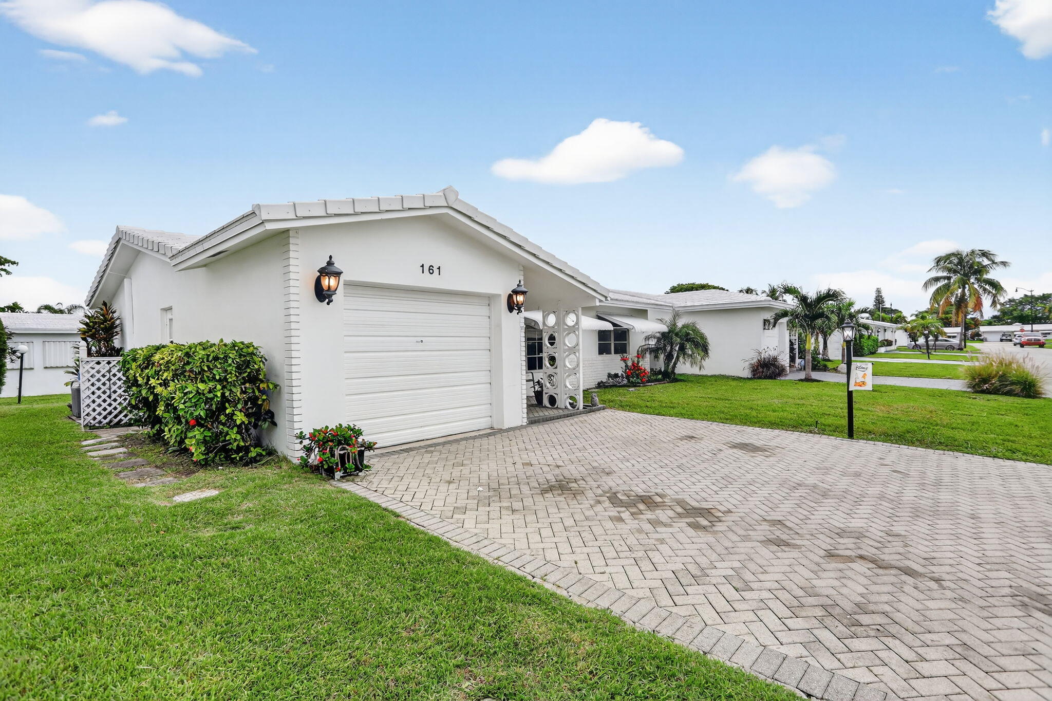 161 Northwest 24th Court Pompano Beach, FL 33064 - Photo 22 of 45 a view of a house with a patio