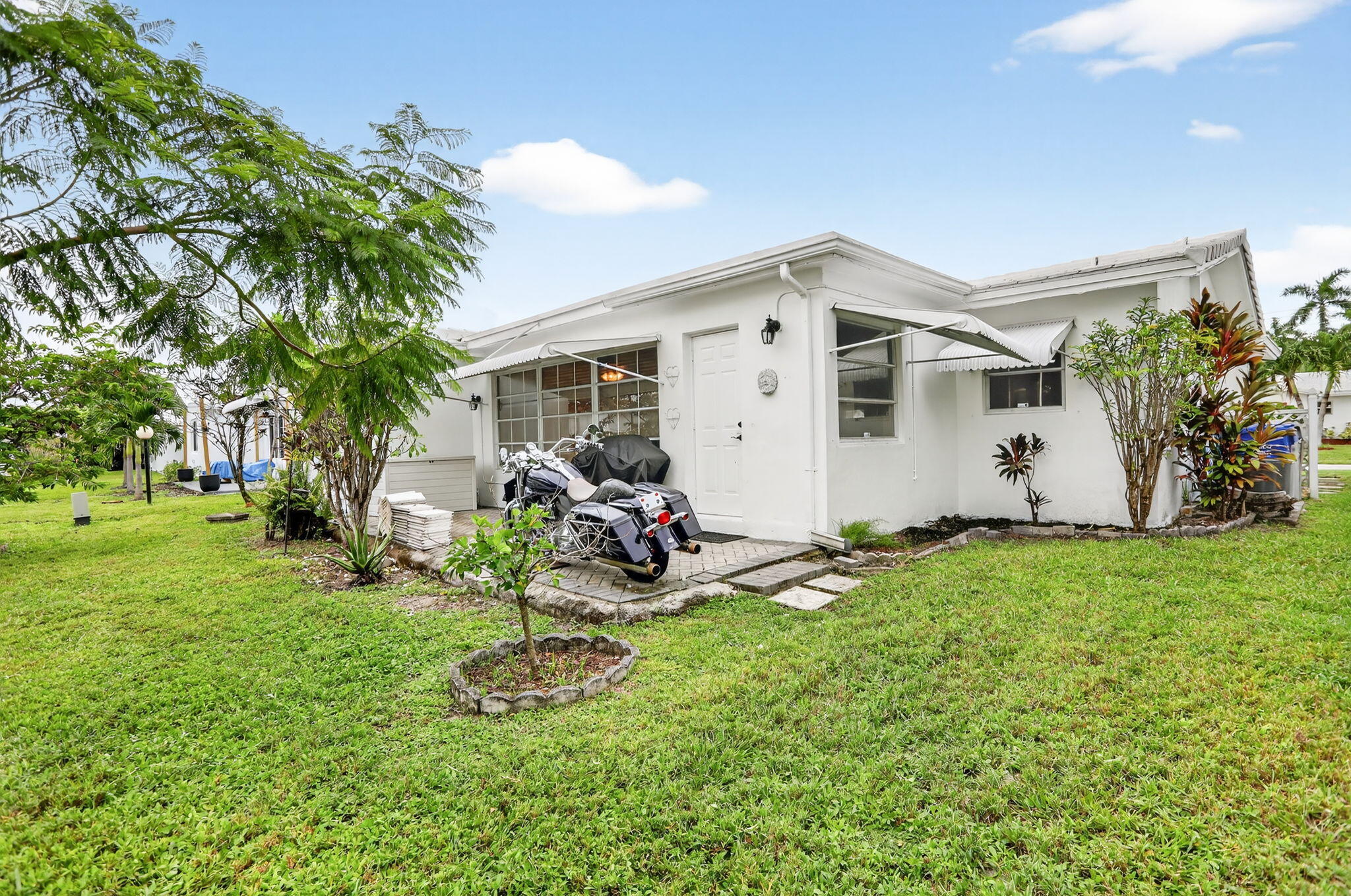 161 Northwest 24th Court Pompano Beach, FL 33064 - Photo 24 of 45 a view of a backyard with a patio