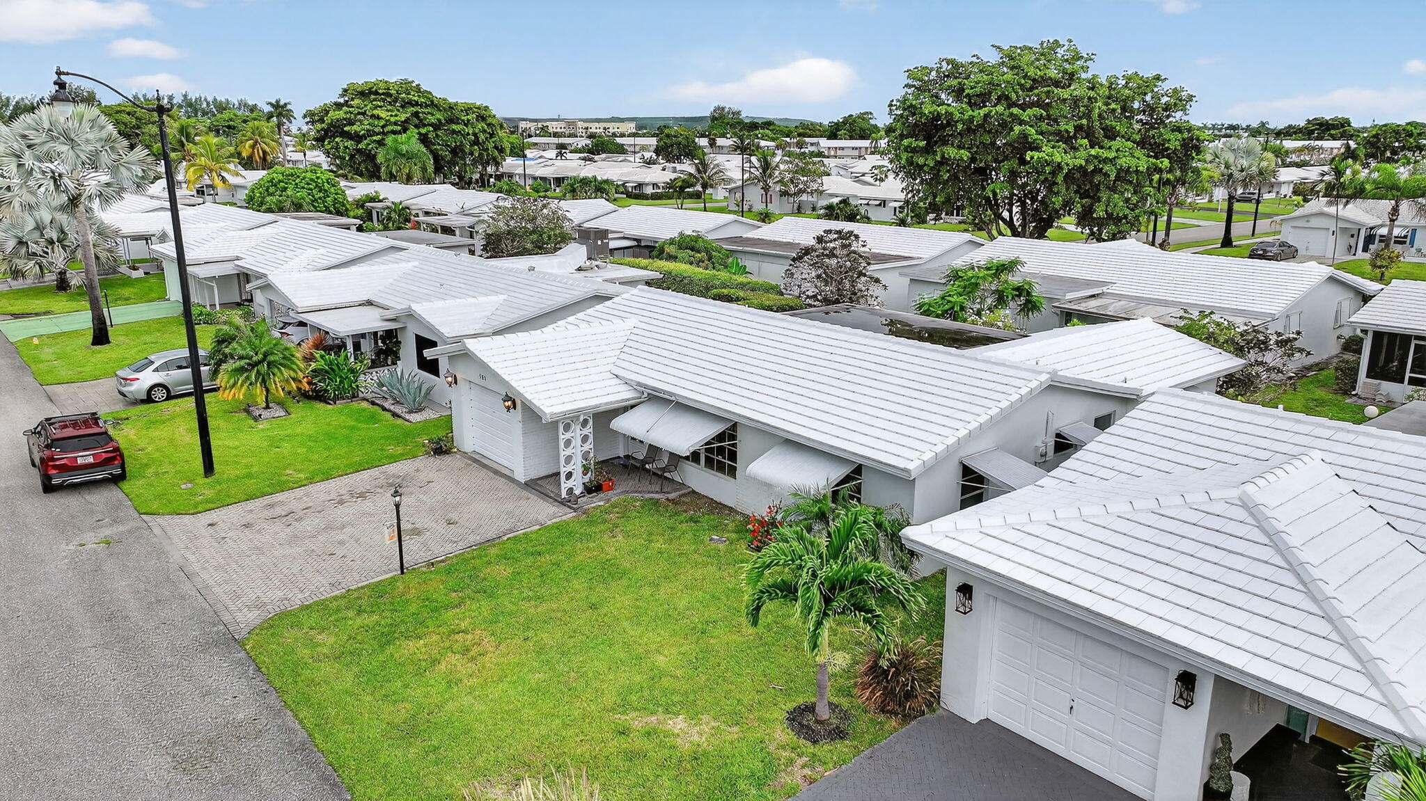 161 Northwest 24th Court Pompano Beach, FL 33064 - Photo 26 of 45 an aerial view of a house with a yard and lake view