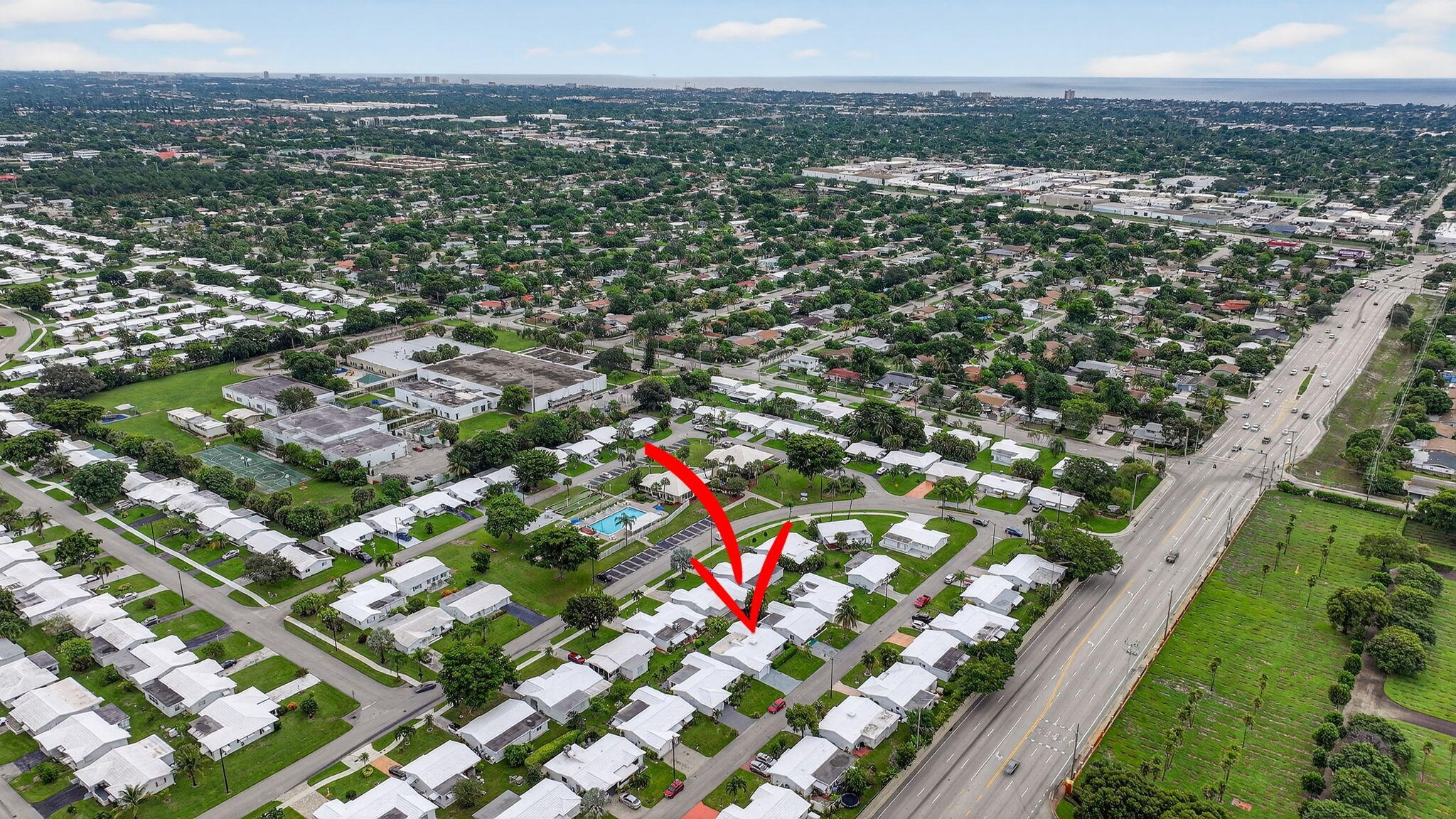 161 Northwest 24th Court Pompano Beach, FL 33064 - Photo 32 of 45 an aerial view of residential houses with outdoor space and trees