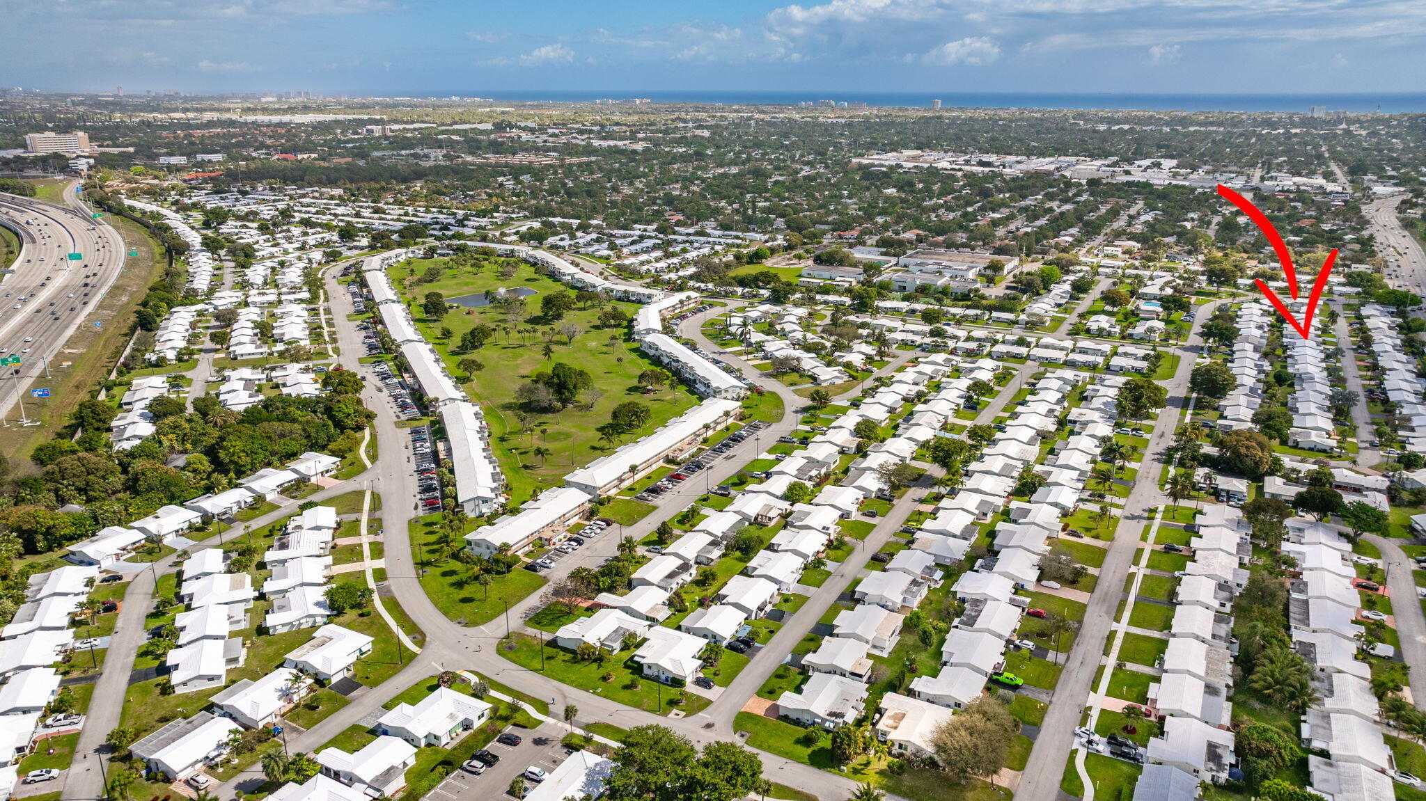 161 Northwest 24th Court Pompano Beach, FL 33064 - Photo 35 of 45 an aerial view of residential building and lake view