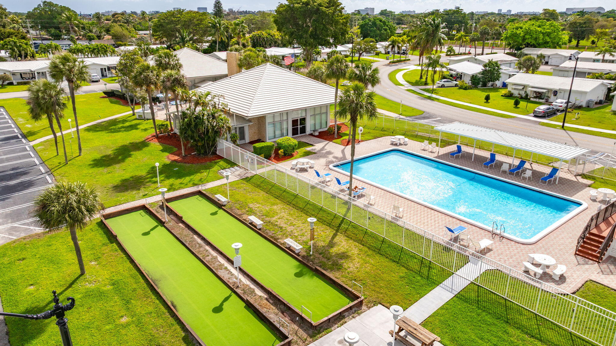 161 Northwest 24th Court Pompano Beach, FL 33064 - Photo 37 of 45 a view of a pool with lawn chairs