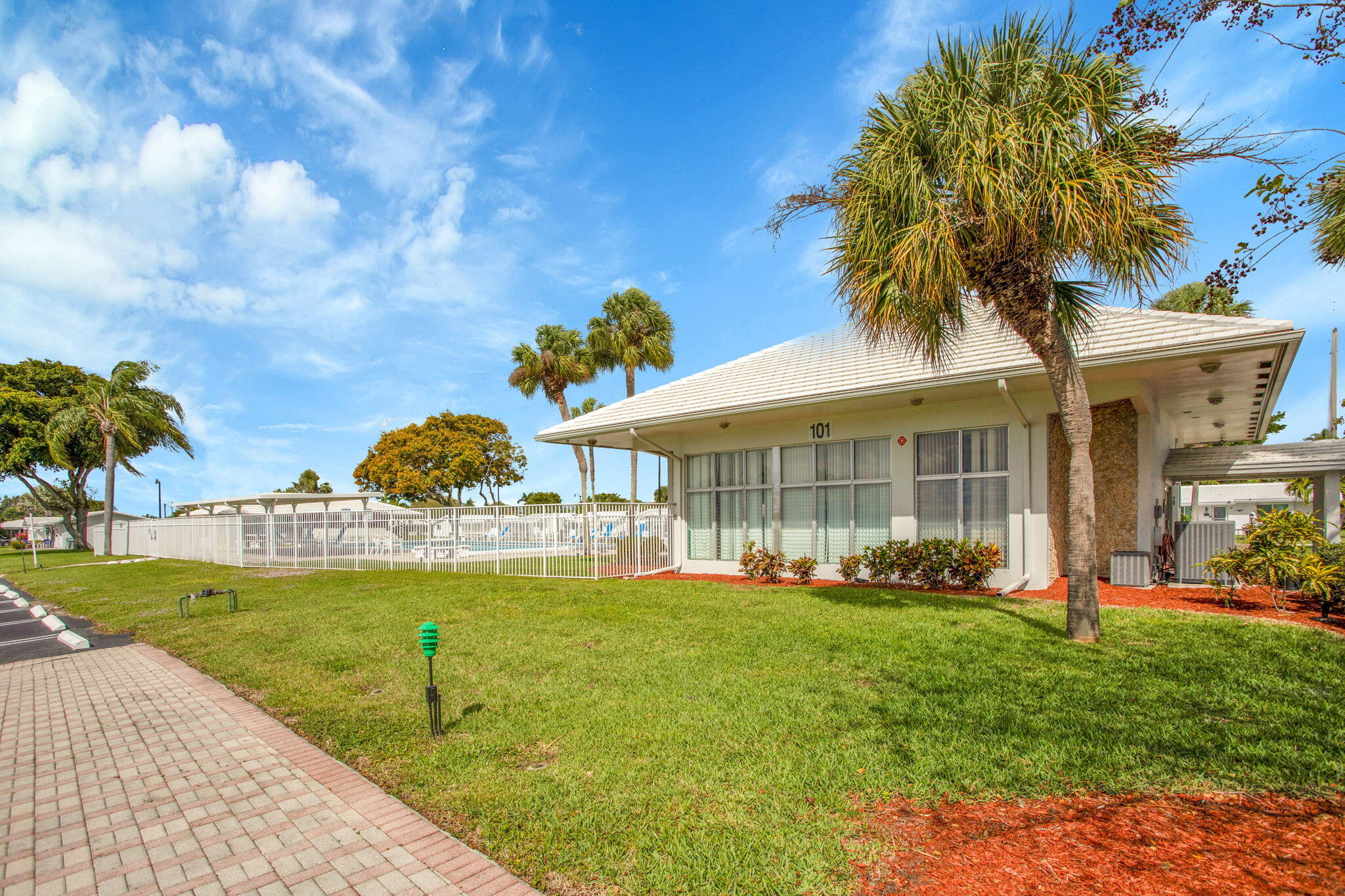 161 Northwest 24th Court Pompano Beach, FL 33064 - Photo 40 of 45 a front view of a house with garden