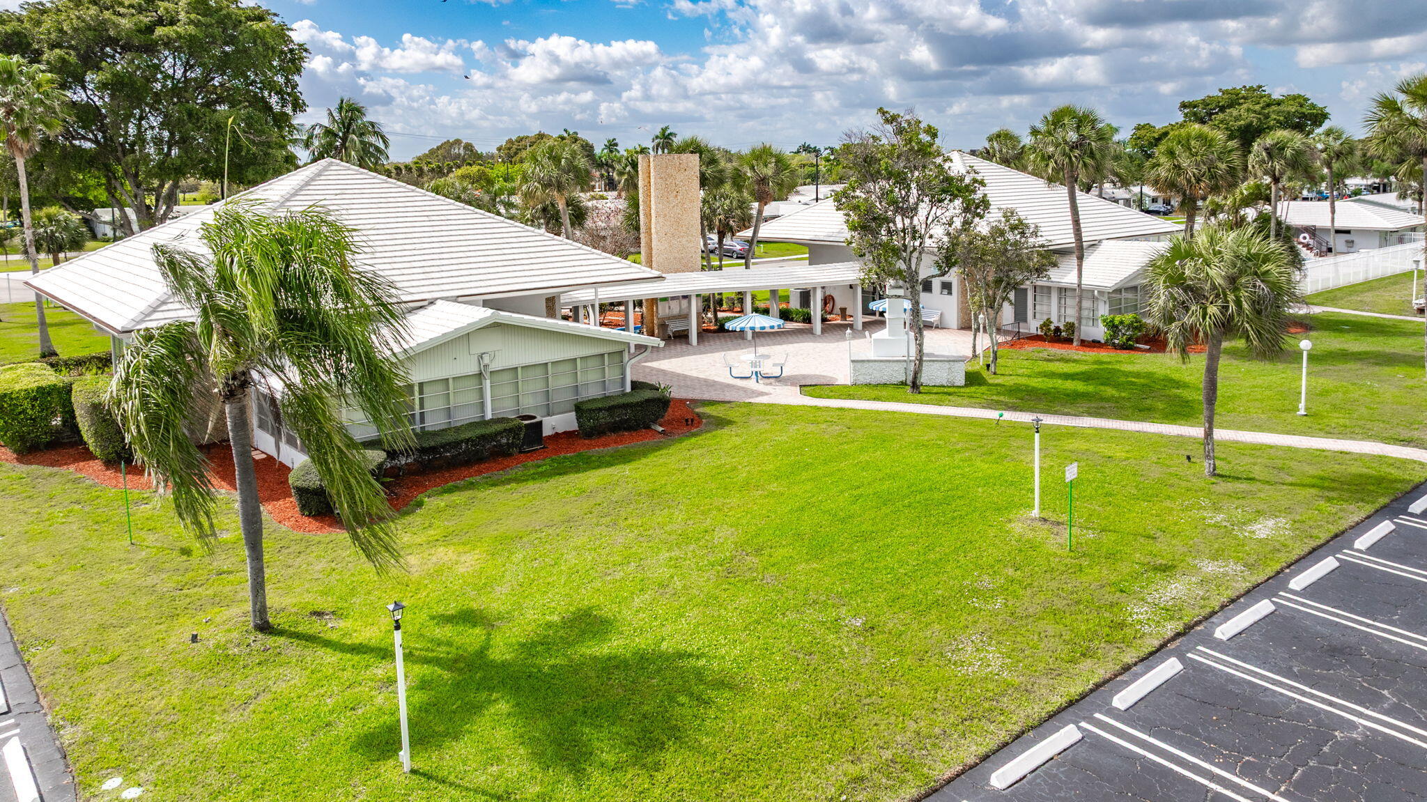 161 Northwest 24th Court Pompano Beach, FL 33064 - Photo 41 of 45 a view of a swimming pool with a patio