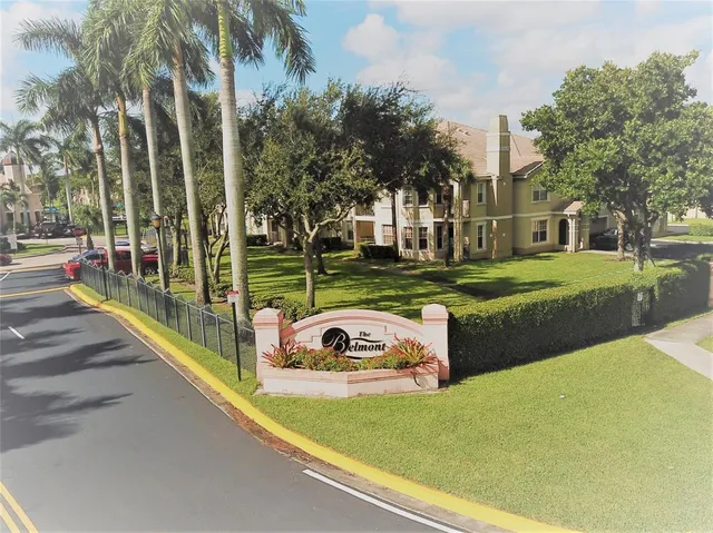 a view of a park with large trees