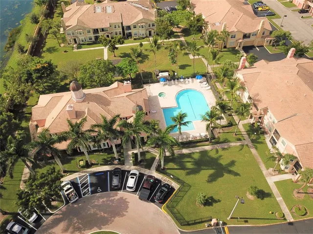 a view of a swimming pool with a yard