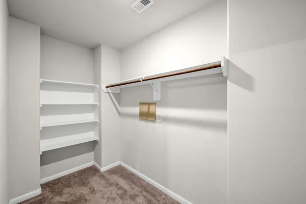 a view of an empty walk in closet