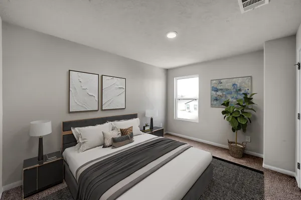a bedroom with bed and window