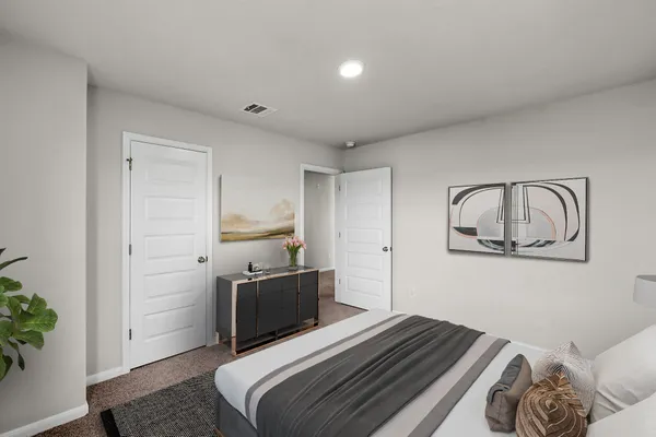 a bedroom with a bed and a sink
