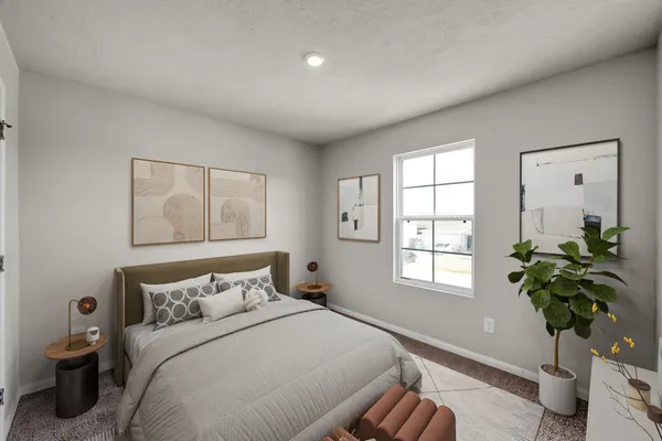 a bedroom with bed and a window