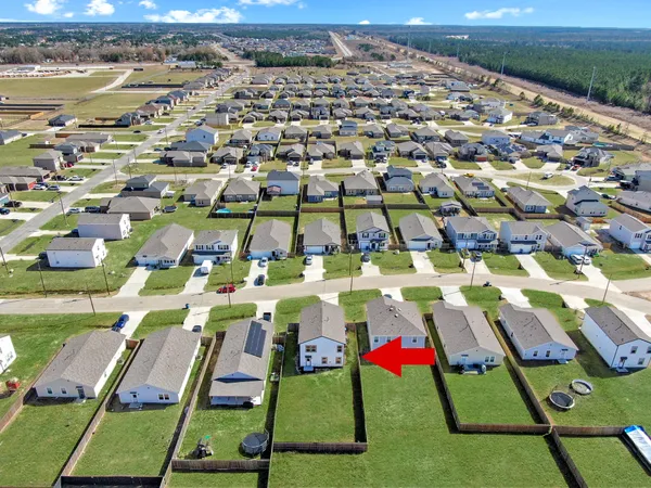 an aerial view of a multi story parking building