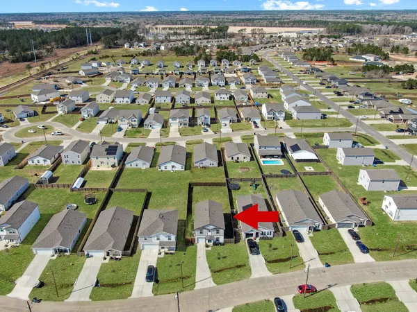 an aerial view of a house with a garden