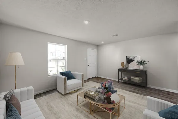 a living room with furniture and a window