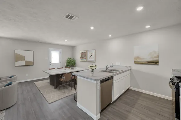 a kitchen with a sink and cabinets