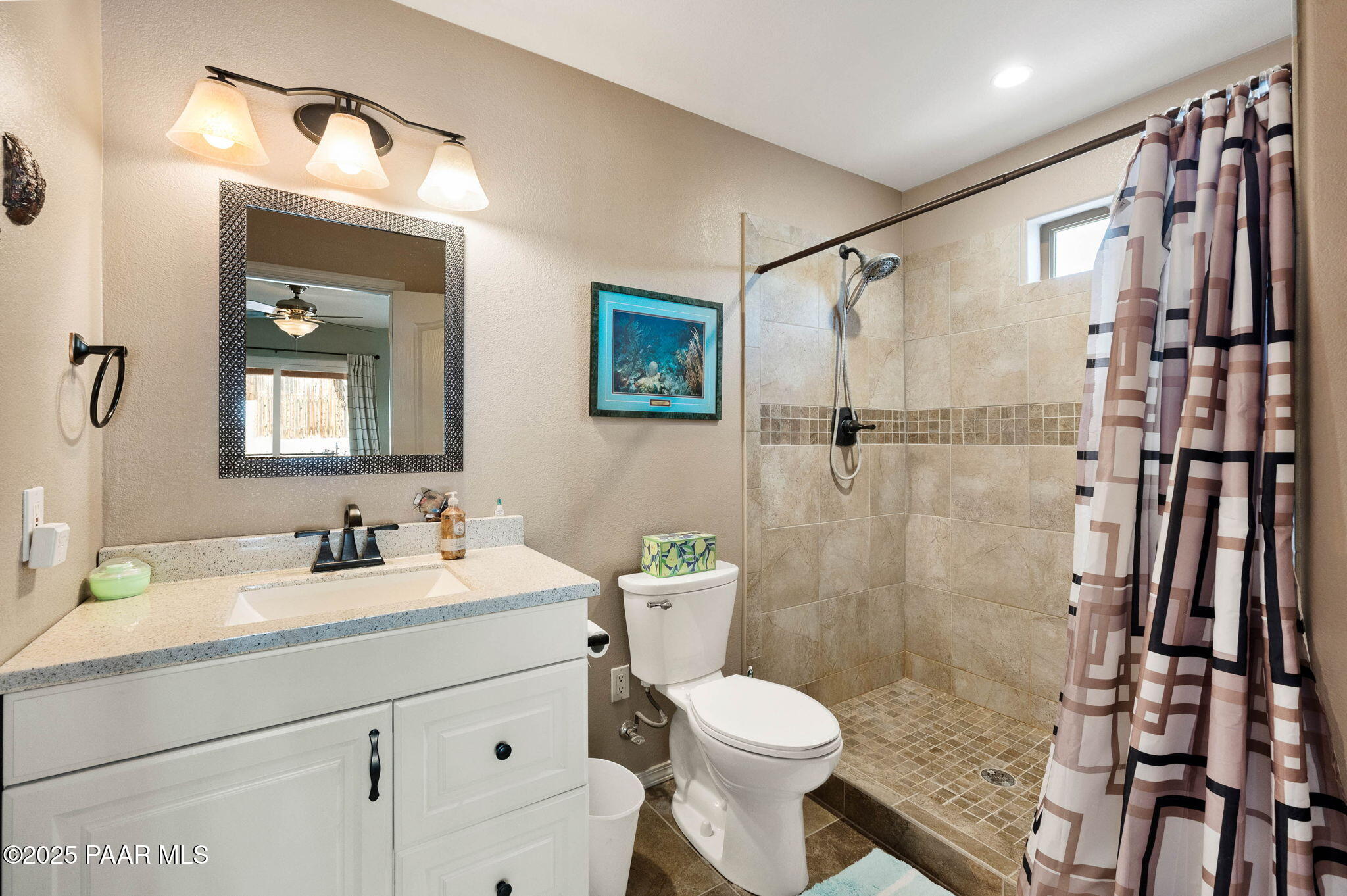 17798 East Trails End Road Mayer, AZ 86333 - Photo 15 of 30 a bathroom with a sink a toilet a shower and a mirror