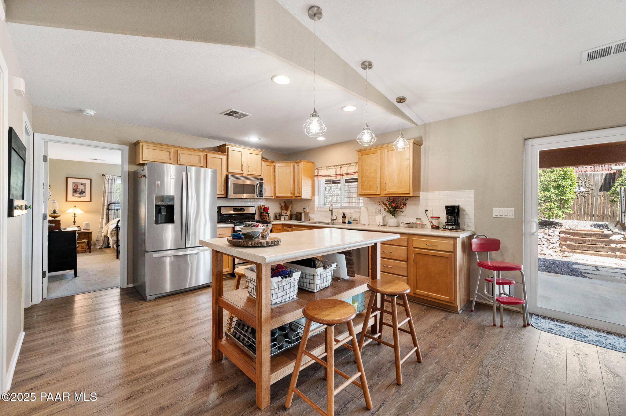 17798 East Trails End Road Mayer, AZ 86333 - Photo 10 of 30 a kitchen with a table chairs refrigerator and cabinets