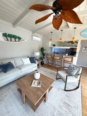a living room with furniture and a lamp