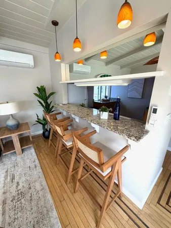 a kitchen with stainless steel appliances granite countertop a sink and a stove