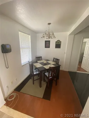 a view of a dining room with furniture
