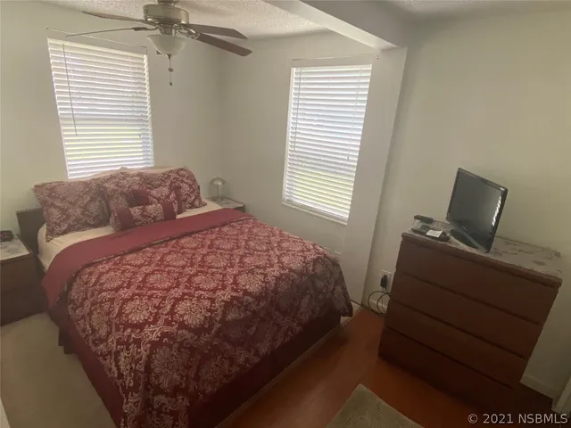a room with closet and wooden floor