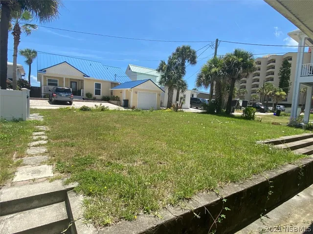 a swimming pool view with a outdoor seating
