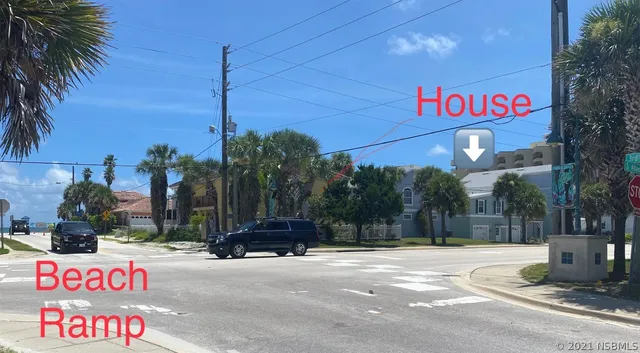 a street sign on a sidewalk next to a road