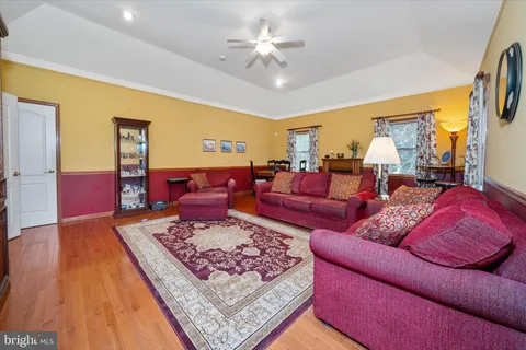 a living room with furniture a rug and a fireplace