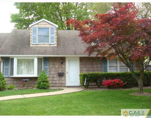 51 Brookville Road Edison, NJ 08817 - Photo 1 of 10 a front view of a house with a yard and garage