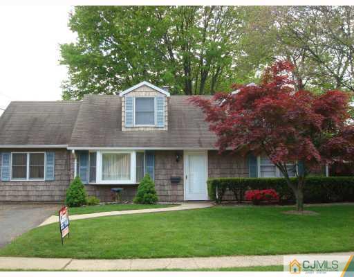 51 Brookville Road Edison, NJ 08817 - Photo 2 of 10 a front view of a house with a garden