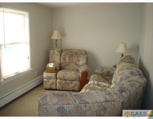 51 Brookville Road Edison, NJ 08817 - Photo 7 of 10 a living room with furniture and a window