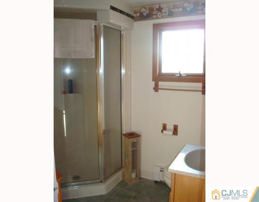 51 Brookville Road Edison, NJ 08817 - Photo 8 of 10 a bathroom with a bathtub and shower