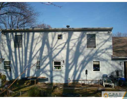 51 Brookville Road Edison, NJ 08817 - Photo 10 of 10 a front view of a house with garden