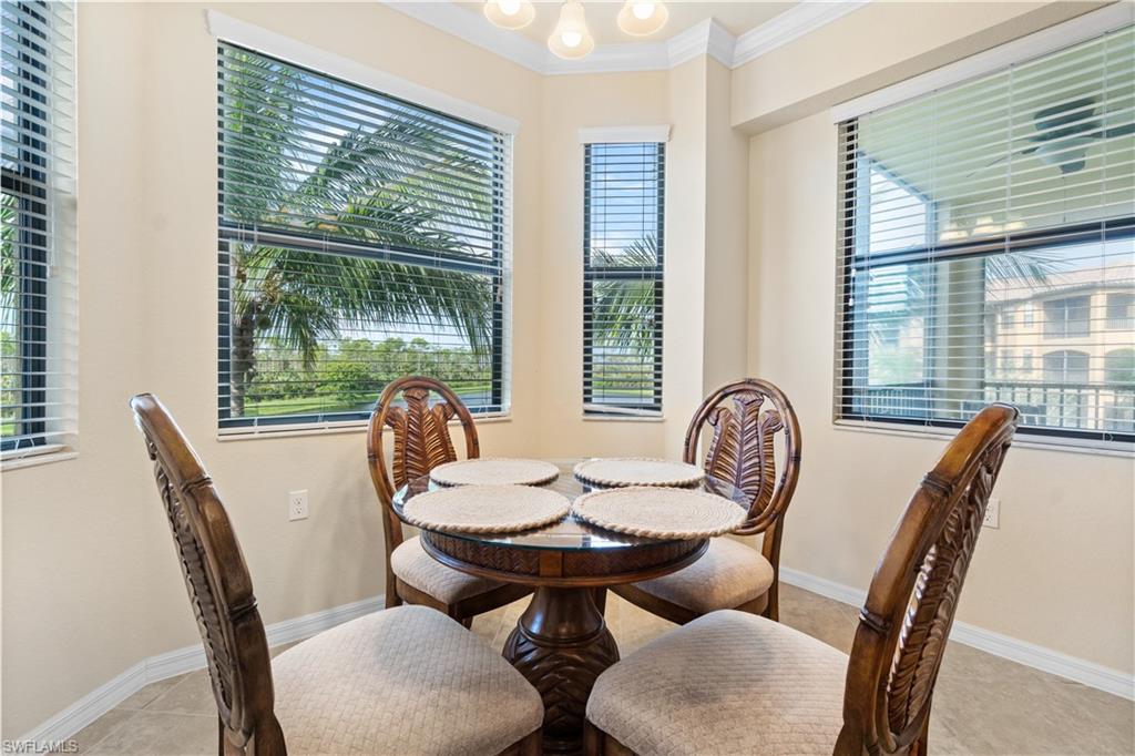 9727 Acqua Court, Unit 436 Naples, FL 34113 - Photo 8 of 40 a view of a dining room with furniture window and outside view