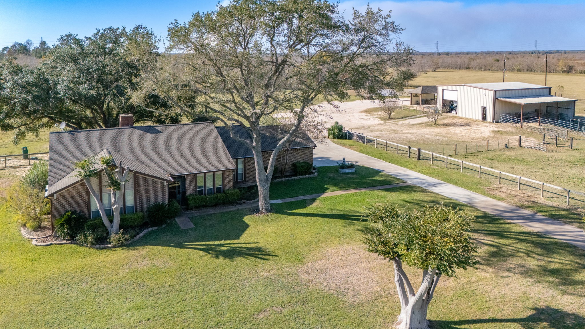 Welcome home to 26253 Sharp Road, situated on a large corner lot with pond, horse stalls, pool and outdoor kitchen!