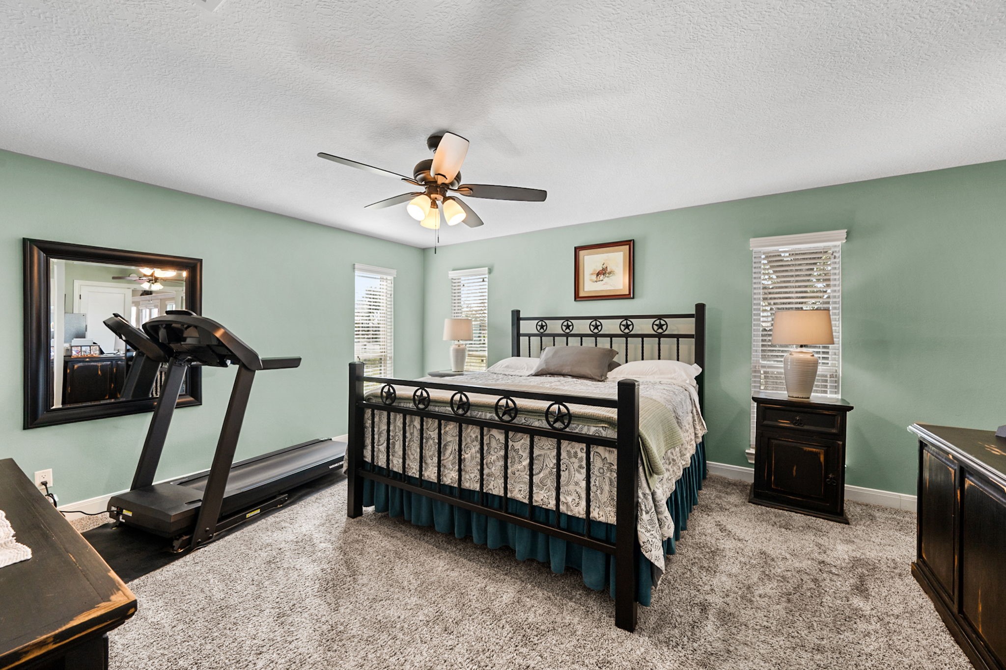26253 Sharp Road Katy, TX 77493 - Photo 11 of 25 The primary bedroom provides a comfortable, private retreat with direct access to the en-suite bath and walk-in closet, and it also connects seamlessly to the home office for added convenience.