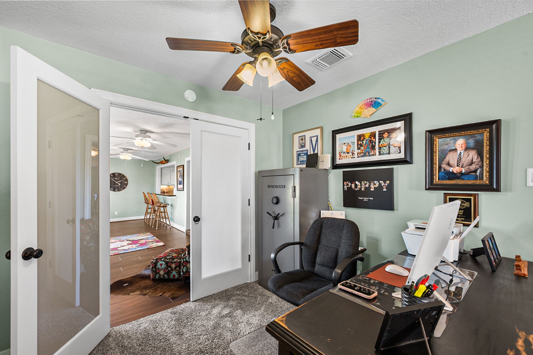26253 Sharp Road Katy, TX 77493 - Photo 12 of 25 The home office offers a spacious layout with double glass-panel doors that provide a clear view and help the space feel open and connected.