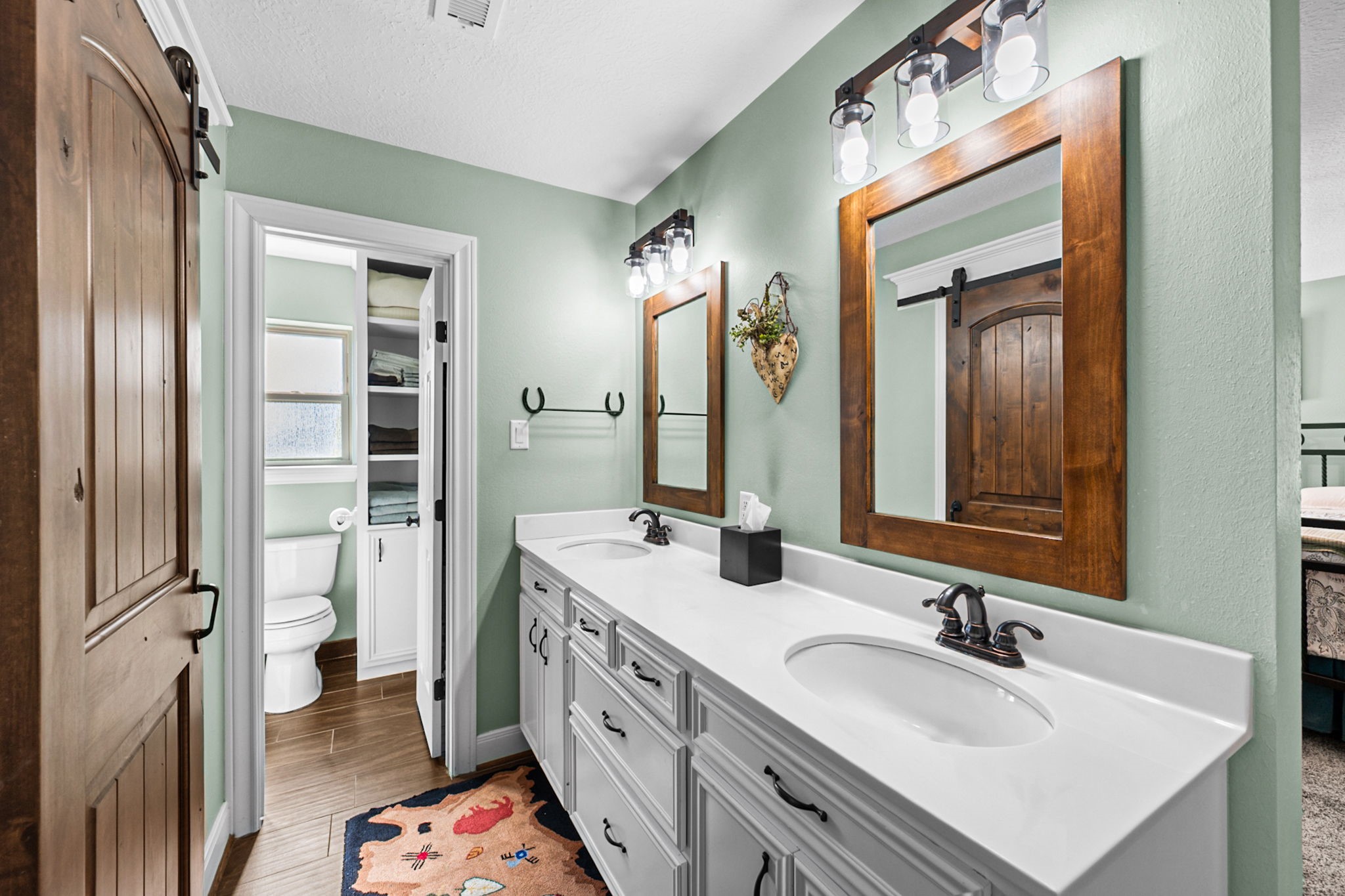 26253 Sharp Road Katy, TX 77493 - Photo 13 of 25 The primary bath offers dual vanities with plenty of storage, roomy enough to move around comfortably.