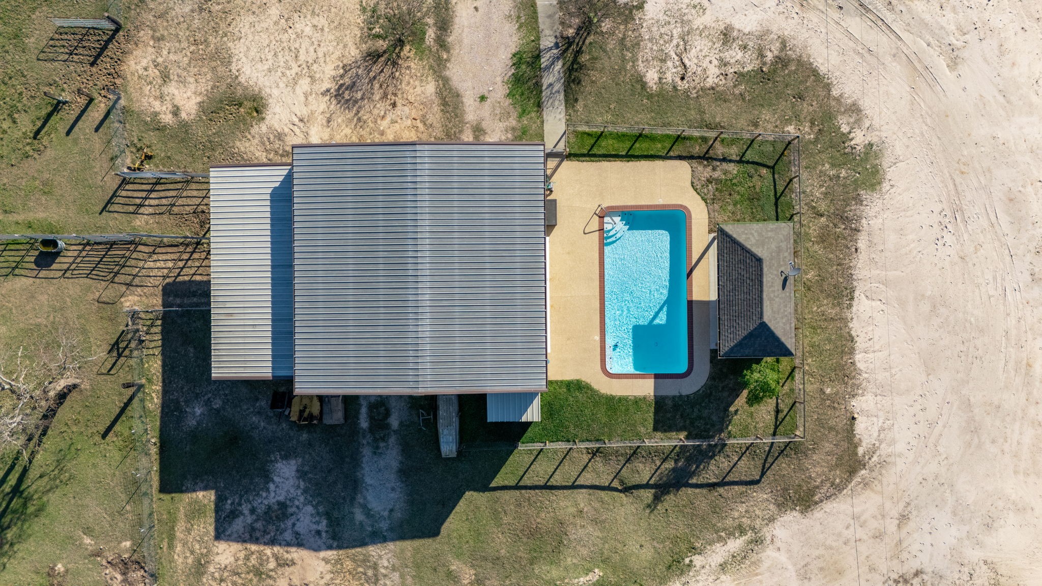 26253 Sharp Road Katy, TX 77493 - Photo 20 of 25 Zoom in on the impressive and inviting pool area and the surrounding space.