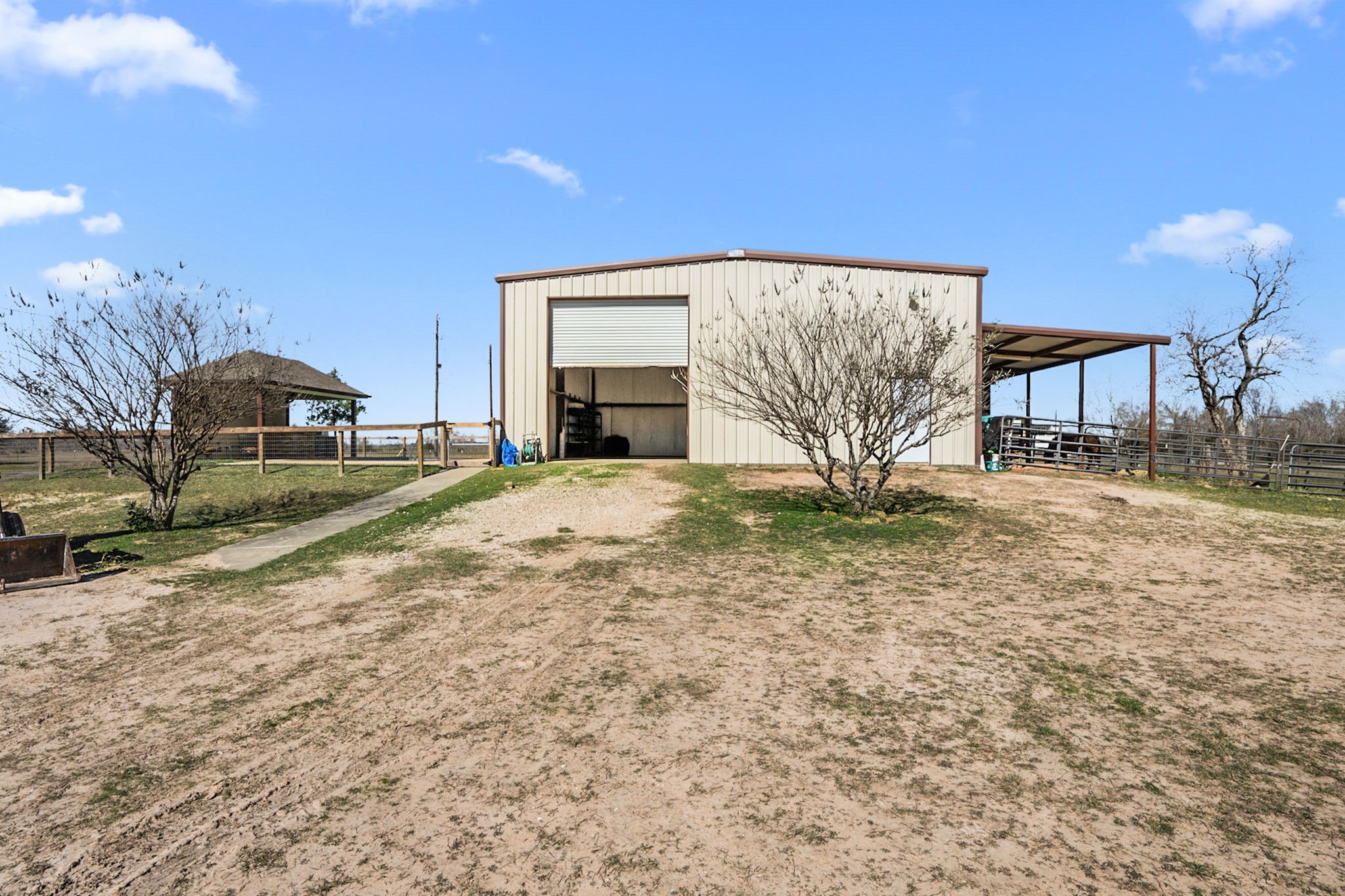 26253 Sharp Road Katy, TX 77493 - Photo 21 of 25 The property includes a 40' x 40' barn that provides ample space for equipment storage or agricultural use, offering flexible options to fit your needs.