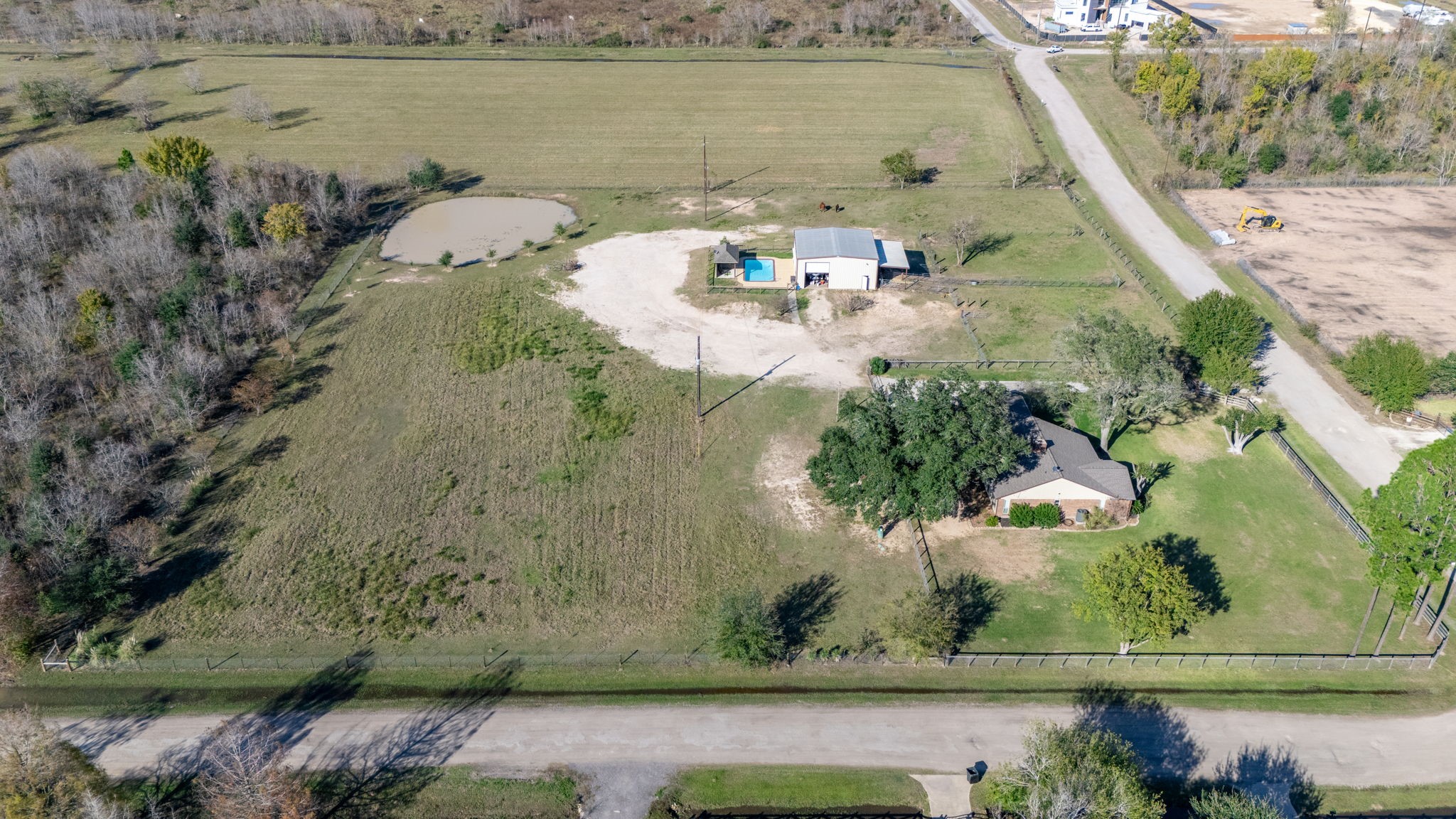 26253 Sharp Road Katy, TX 77493 - Photo 25 of 26 This property features a natural pond, creating a peaceful outdoor spot and adding to the land’s overall appeal.